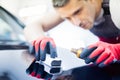 Man worker on a car wash Royalty Free Stock Photo