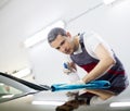 Man worker on a car wash Royalty Free Stock Photo