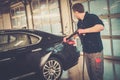 Man worker on a car wash Royalty Free Stock Photo