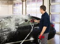 Man worker on a car wash Royalty Free Stock Photo