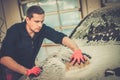 Man worker on a car wash Royalty Free Stock Photo