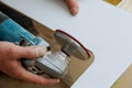 Man worker cutting beige tile with a saw on a cutting flooring tile Royalty Free Stock Photo