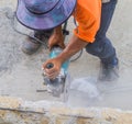 Man worker cutting concrete with Circular saw. Royalty Free Stock Photo