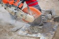 Man worker cutting concrete circular tool diamond blade Royalty Free Stock Photo