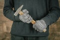 Man worker hand holding a old hammer, closeup, concept for repair work Royalty Free Stock Photo