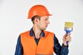 Man worker hard hat painter with brush tool, renovation concept Royalty Free Stock Photo