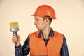 Man worker hard hat painter with brush tool, renovation concept Royalty Free Stock Photo