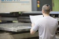 Man worker look drawing blueprints in factory workshop