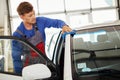 Man worker polishing car on a car wash Royalty Free Stock Photo