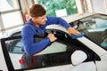 Man worker polishing car on a car wash Royalty Free Stock Photo