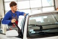 Man worker polishing car on a car wash Royalty Free Stock Photo