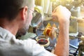 A man producing an electrical copper coil for high-voltage trans