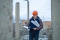 The man worker wear a orange helmet with construction site Royalty Free Stock Photo