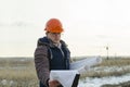 The man worker wear a orange helmet with construction site Royalty Free Stock Photo