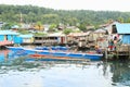 Man working on anchored boat in Manokwari Royalty Free Stock Photo