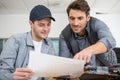 man working with apprentice in printing house Royalty Free Stock Photo