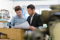 man working with apprentice in printing house Royalty Free Stock Photo