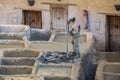 Man working as a tanner in the dye pots at leather tanneries in the ancient medina Royalty Free Stock Photo