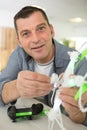 man working on assembling quadcopter drone Royalty Free Stock Photo