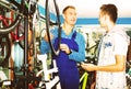 Man working with bicycles wheel and helping boy