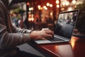 Man working in cafe, using laptop. Typing on keyboard. Generative AI Royalty Free Stock Photo