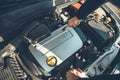 Man working in car motor. Royalty Free Stock Photo