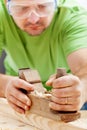 Man working with carpenter's plane Royalty Free Stock Photo