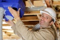 man working on ceiling pipes Royalty Free Stock Photo