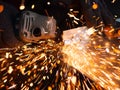 Man is working with a circular saw. Sparks fly from hot metal. Royalty Free Stock Photo
