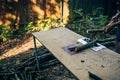 Man working with circular saw to make firewood