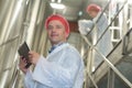 man working with colleague in factory Royalty Free Stock Photo