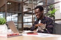 Man working with computer holding a kitten Royalty Free Stock Photo