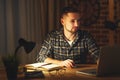 Man working on computer at home at night in dark Royalty Free Stock Photo