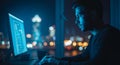 Man Working on Computer at Night with City Lights in Background coding programming Royalty Free Stock Photo