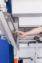 Operator working at programmable machine Royalty Free Stock Photo