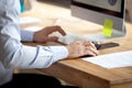 Man working on computer typing business message on keyboard Royalty Free Stock Photo