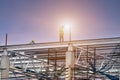 Man working on construction site with scaffold and building with sky background,scaffolding for construction factory