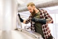 Man working at craft brewery or beer plant Royalty Free Stock Photo