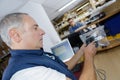 Man working at desk in warehouse scanning barcode Royalty Free Stock Photo