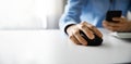 man working with desktop computer and using smart phone in office Royalty Free Stock Photo