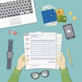 Man working with documents. Men`s hands hold the accounts, payroll, tax form. Workplace Top view Royalty Free Stock Photo
