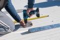 Man working with drill in solar panel installation