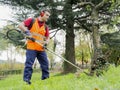 Man working edge trimmer Royalty Free Stock Photo