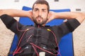 Man working on electro muscular stimulation machine Royalty Free Stock Photo