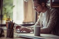 Man working on freelance keyboarding on laptop. Royalty Free Stock Photo