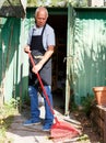 Man working with garden rake Royalty Free Stock Photo