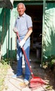 Man working with garden rake Royalty Free Stock Photo