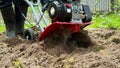 Man working with garden tiller engine in 4K VIDEO