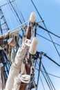 Man working at heights on a sailboat mast Royalty Free Stock Photo