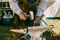 Man working with his hands on with a metal hammer mallot